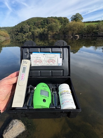 Water testing kit open on the riverbank at Bigsweir